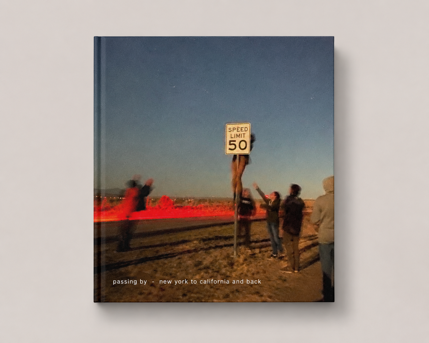 Passing By photo book cover with speed limit sign and red road light